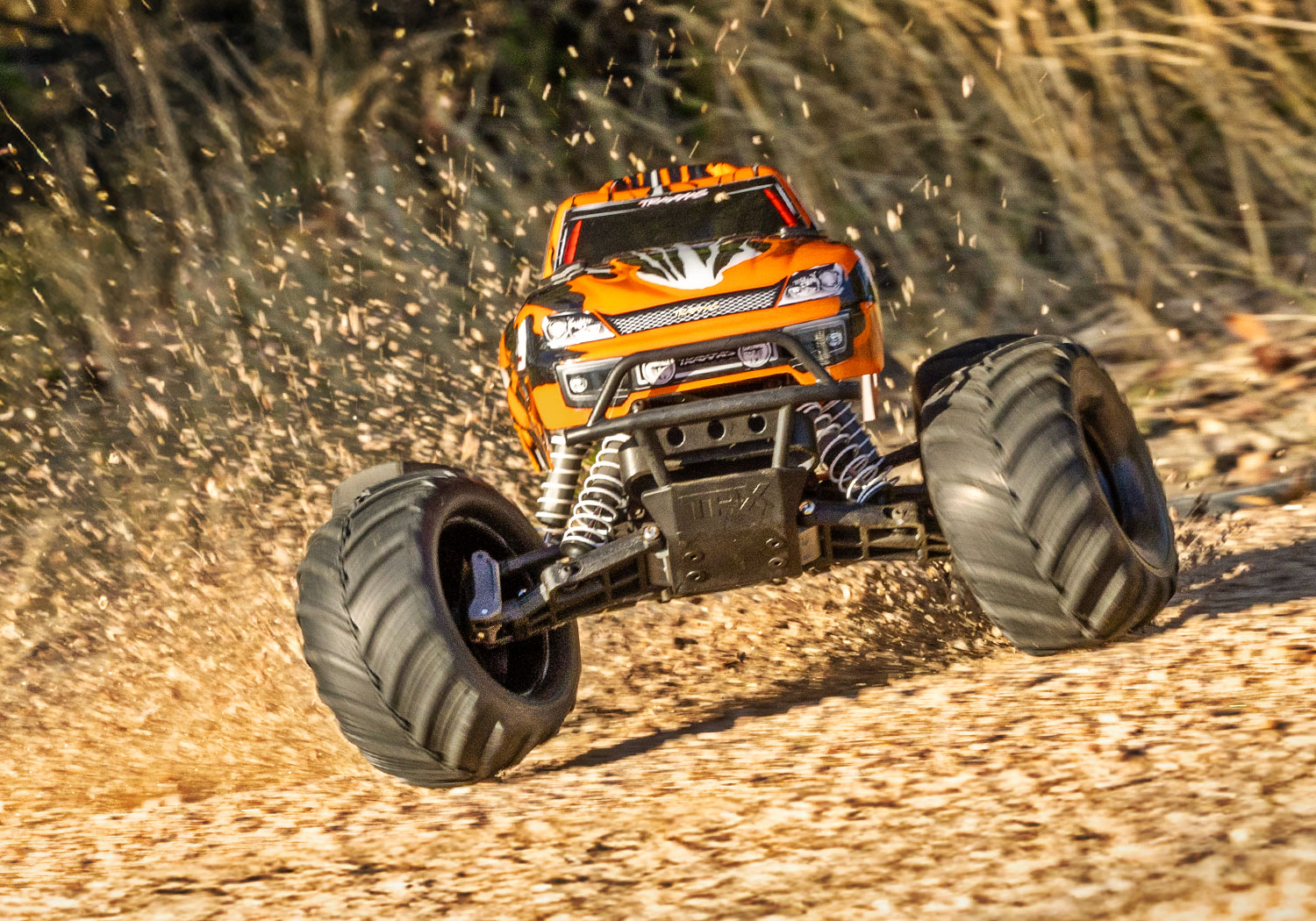Traxxas-36254-8–ORNG-5-Stampede-Monster-Truck-orange-Action-Shot