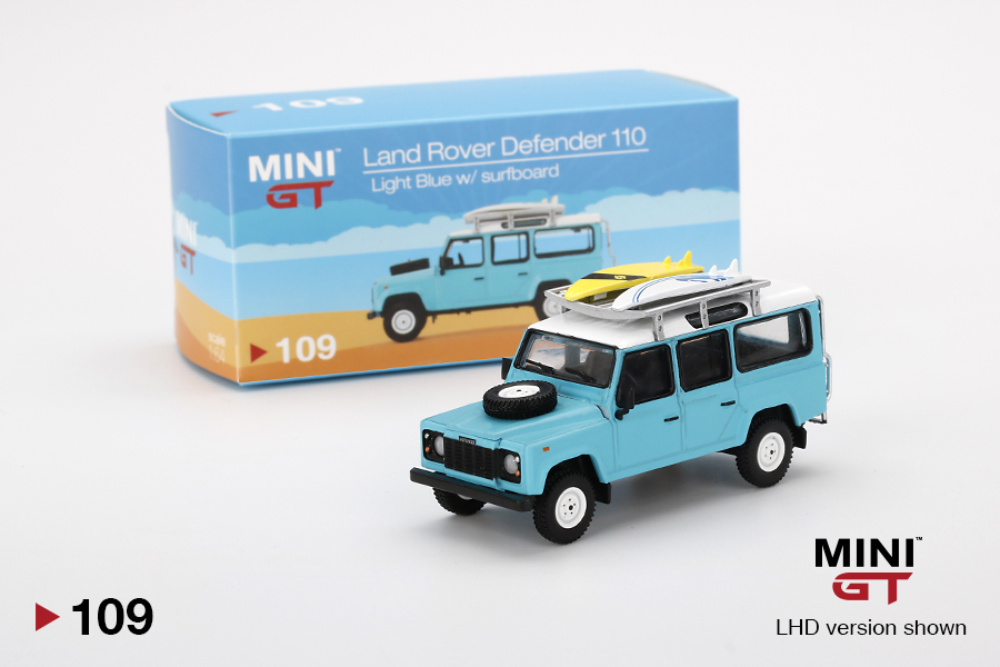 mini-gt-MGT00109-L-Land-Rover-Defender-110-light-blue-with-surfboard